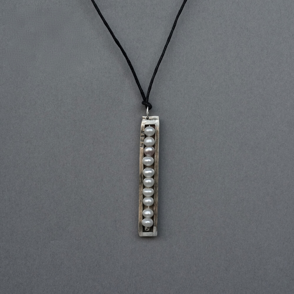Melanie Decourcey/Pendant On String/Pearls in a row pendant