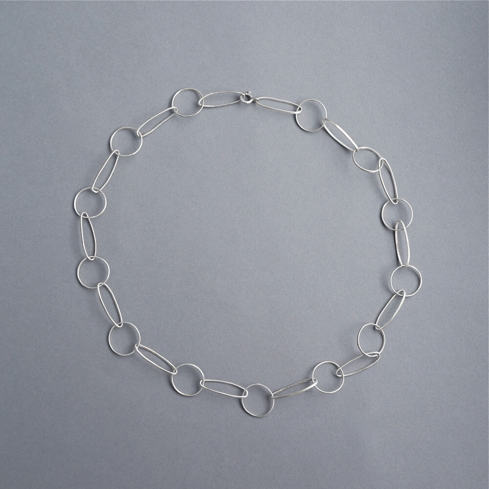 Melanie Decourcey/oval round silver link necklace