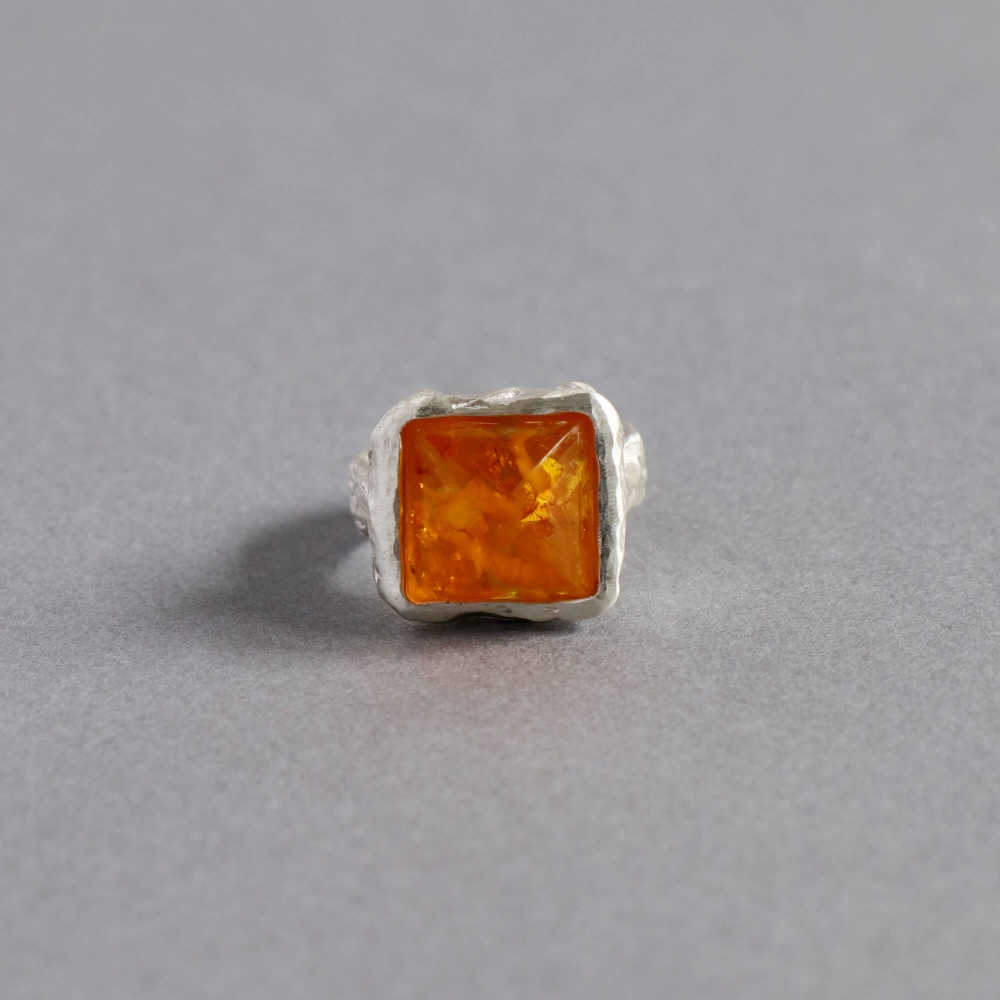 Melanie Decourcey/silver ring fextured silver with amber