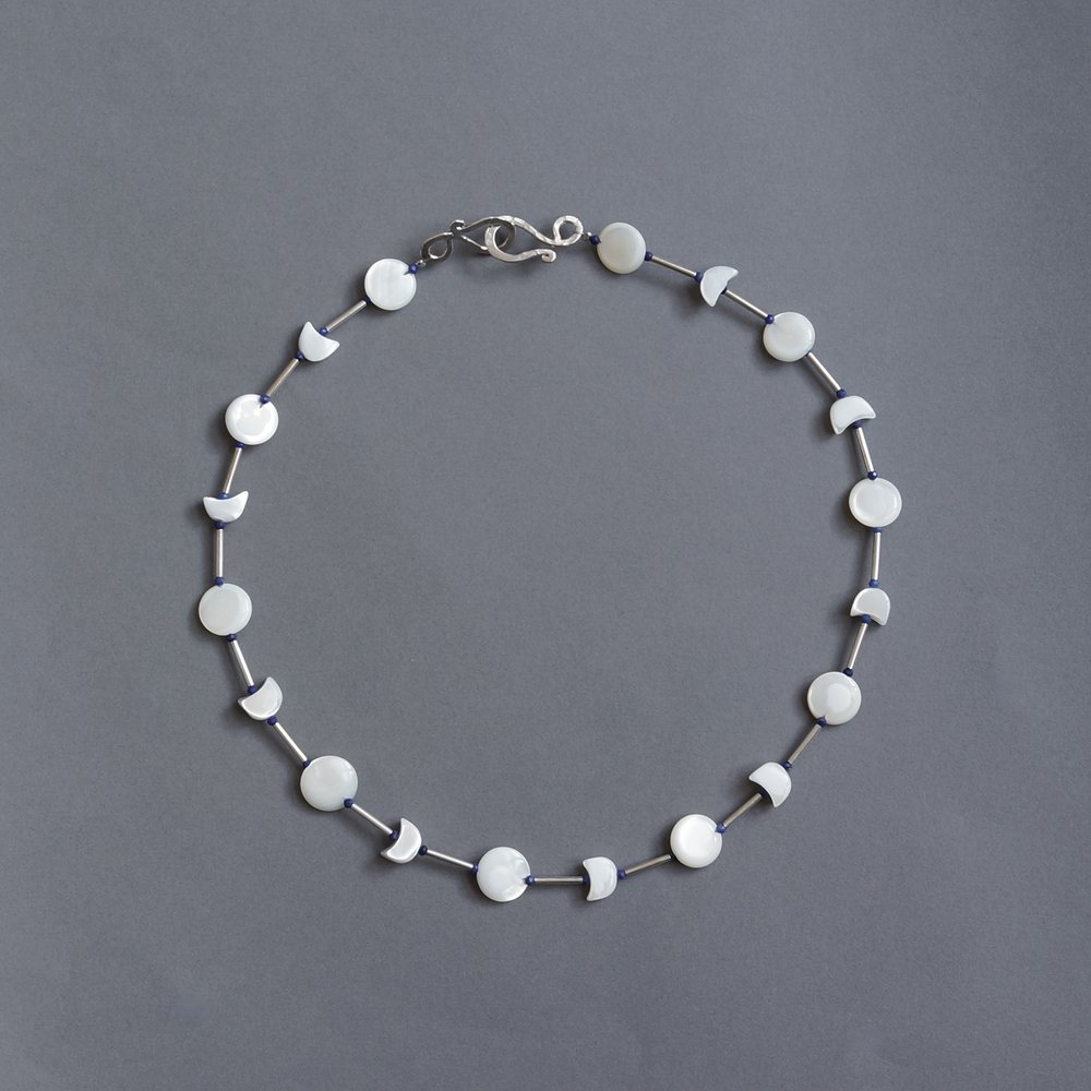 Melanie Decourcey/Beaded Necklace/Full moon & half moon mother of pearl with silver and lapis beads