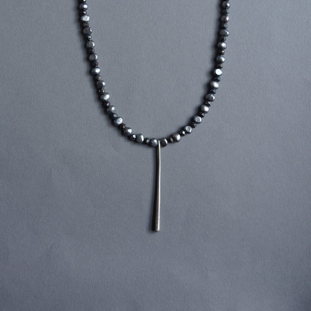 Melanie Decourcey/Beaded Necklace/Grey pearl and hematite with long silver pendant