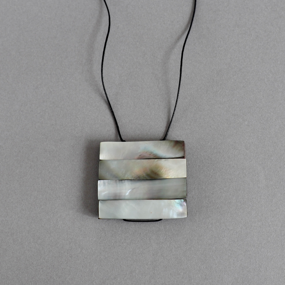 Melanie Decourcey/Mother of pearl on wood pendant