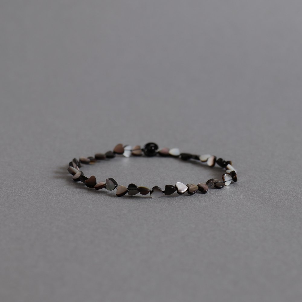Melanie Decourcey/ black mother of pearl heart shaped beads DNA bracelet