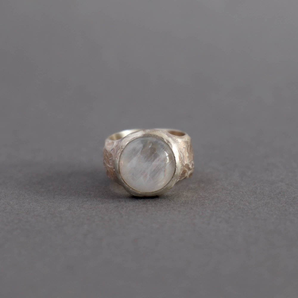 Melanie Decourcey / textured ring with round moonstone