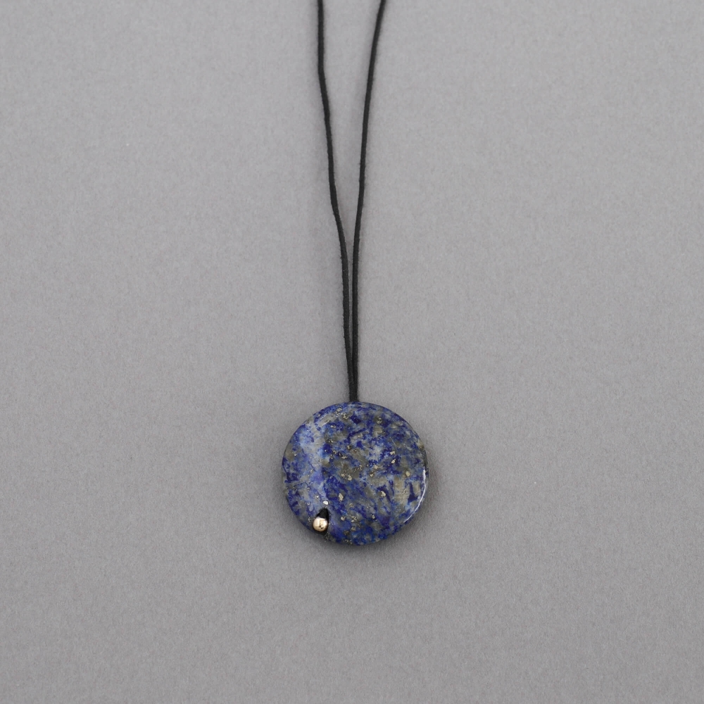 Melanie Decourcey / pendant on string / round lapis lazuli 