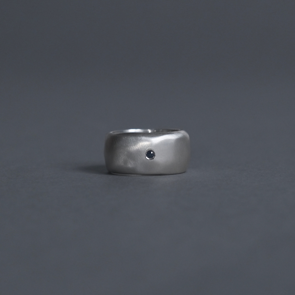 Melanie Decourcey / wide silver band with sapphire 