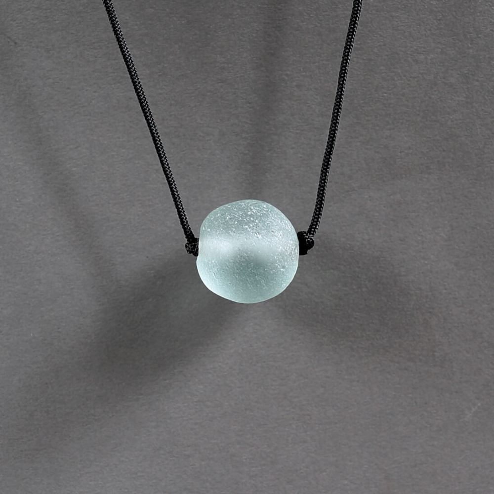 Melanie Decourcey / antique round water blue glass bead on string