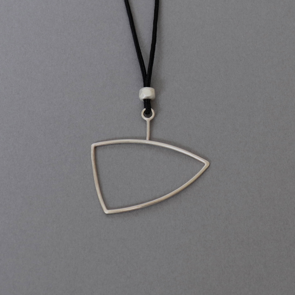 Melanie Decourcey / pendant on string / freestyle triangle silver pendant