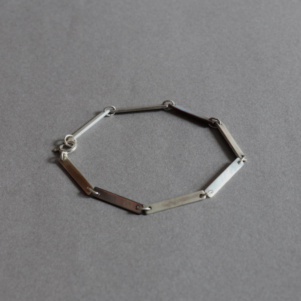 Melanie Decourcey / white&black mother of pearl alternating with long silver parts