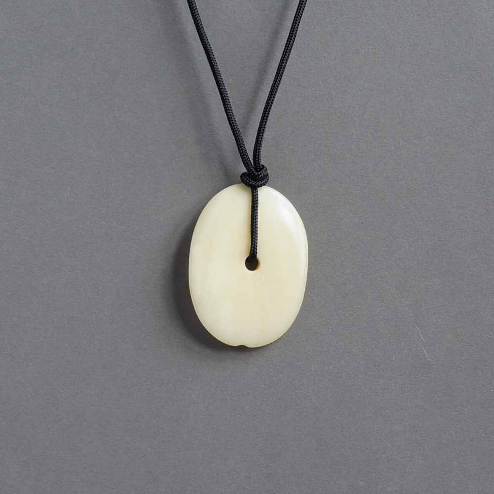 Melanie Decourcey / oval ivory color bone pendant