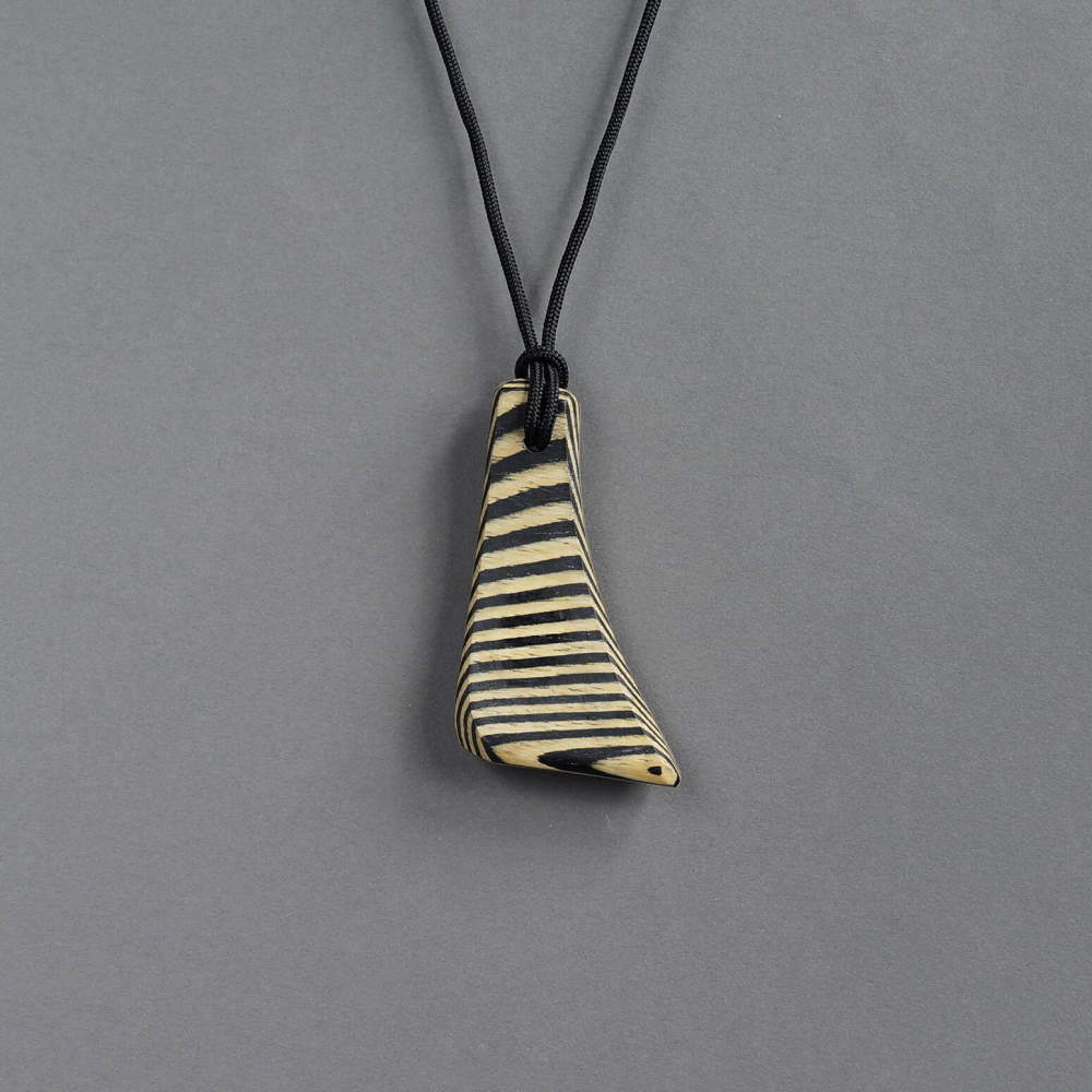 Melanie Decourcey / zebra striped wood pendant