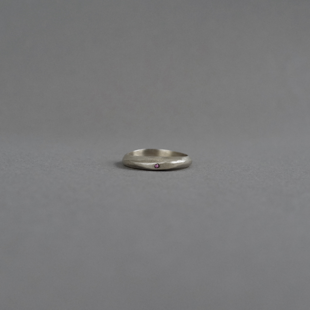 Melanie Decourcey / flat silver ring with tiny ruby 