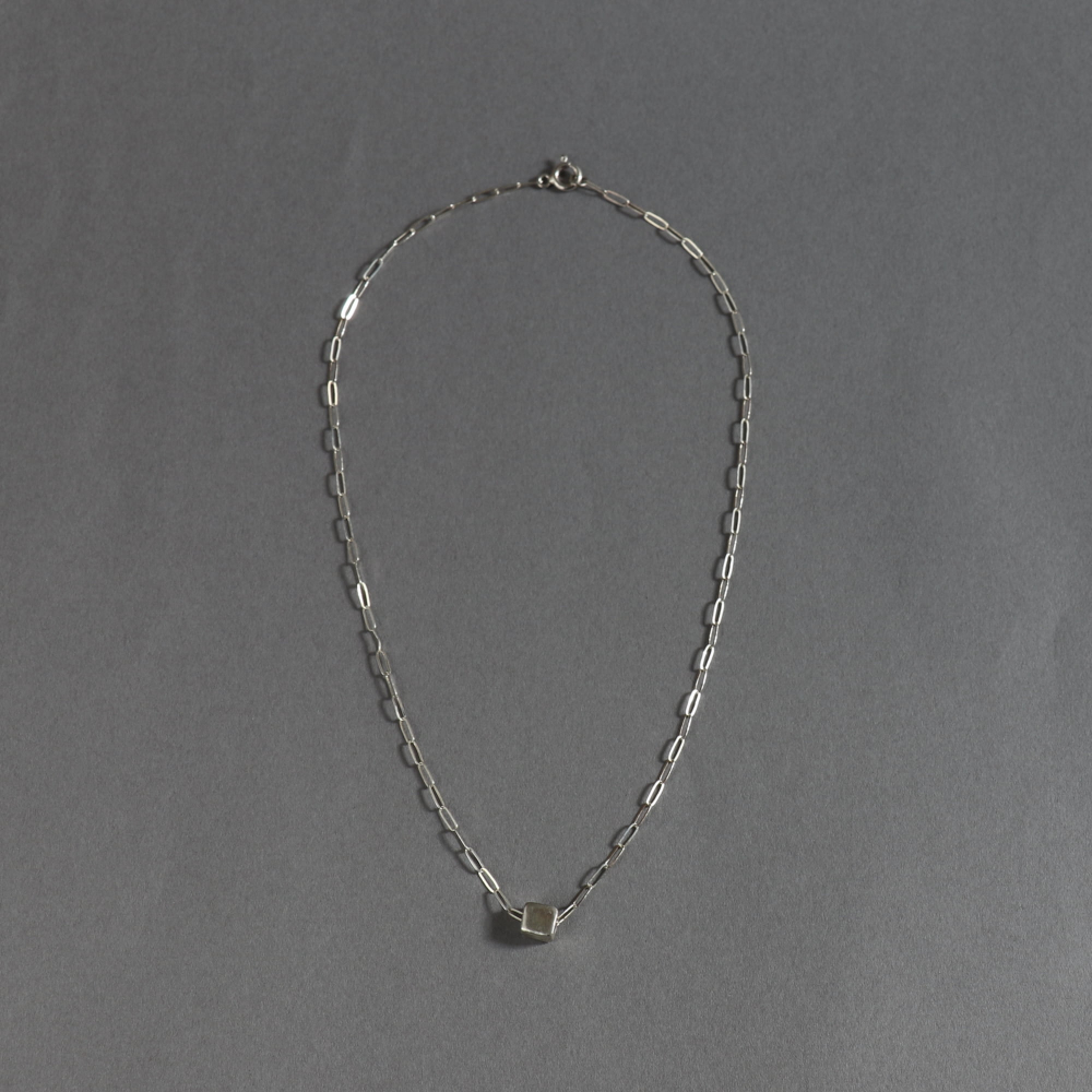 Melanie Decourcey / Beaded Necklace / silver chain with silver cube center