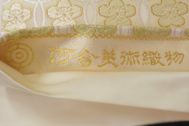 銀座【L-6902】西陣 河合美術織物 袋帯 薄卵色 丸文繋ぎ（落款入