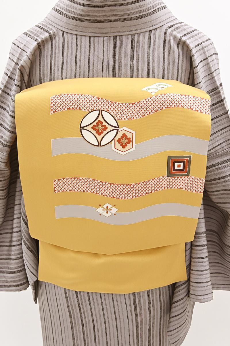 銀座【H-0692】塩瀬地 染名古屋帯 淡い深支子色 流線に七宝や亀甲など