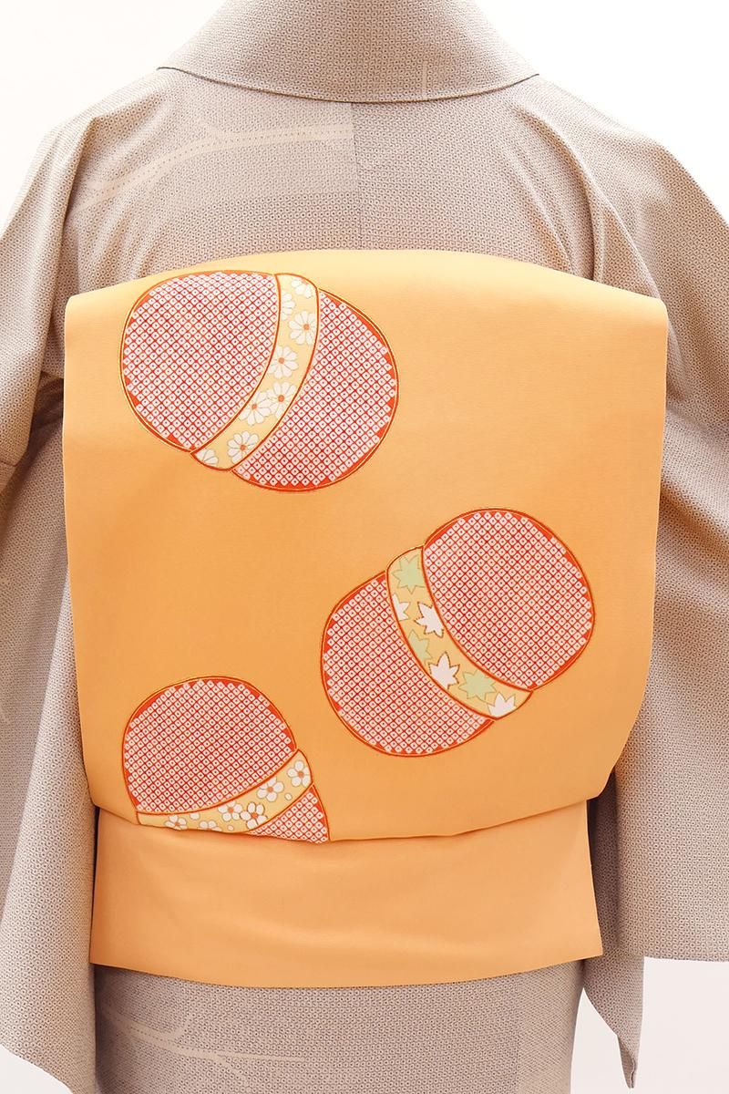 銀座【H-0717】塩瀬地 染名古屋帯 淡い橙色 蹴鞠文 - 銀座きもの青木