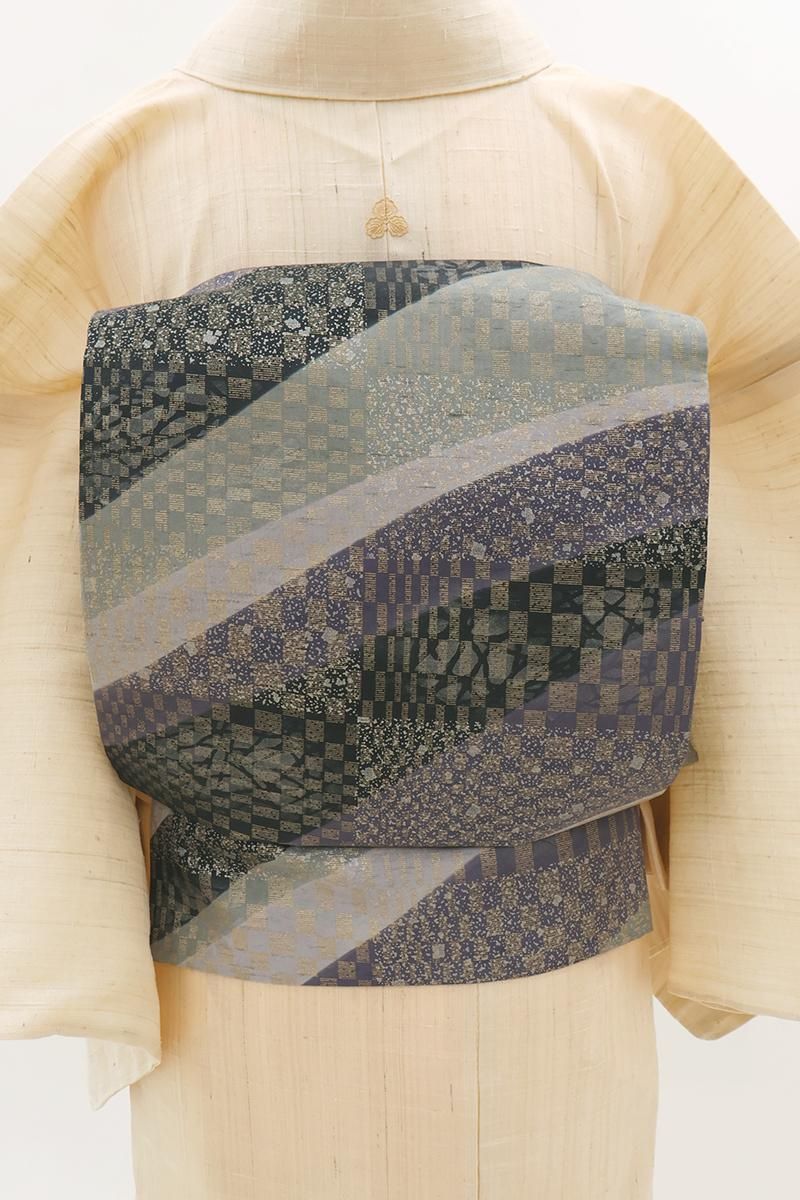 銀座【L-8404】白山工房製 牛首紬地 洒落袋帯 錆桔梗色 変わり市松に抽象文（落款入）