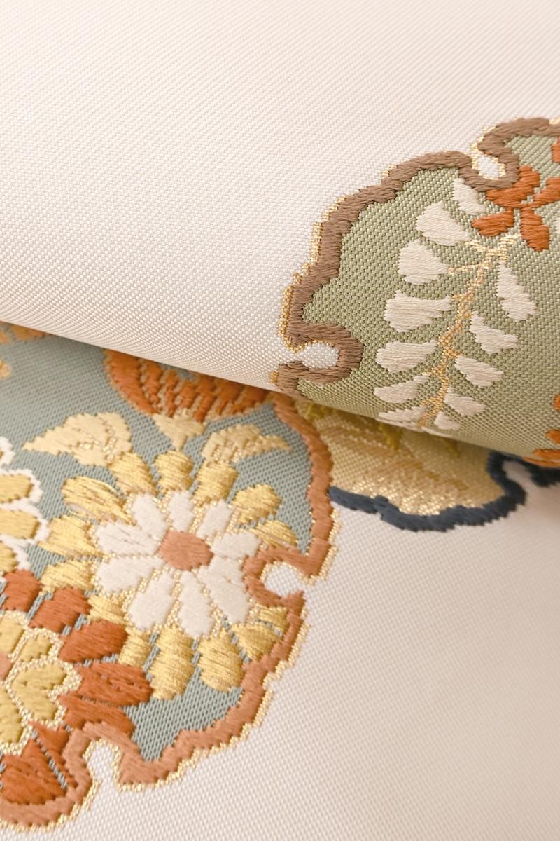 未使用品 名古屋帯 茶 縮緬地 雪輪 花文 蝶 いろはにほへと 長さ3m82cm 未使用品 名古屋帯 茶 縮緬地 雪輪 花文 蝶 いろはにほへと 長さ